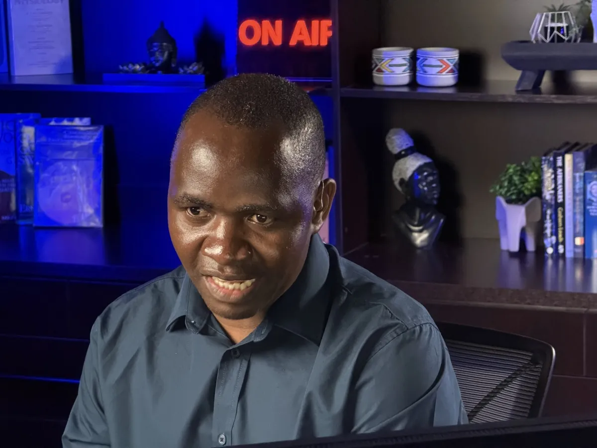 Specialist mid-presentation, ON AIR sign visible